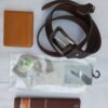 leather-wallet-belt-combo-pack-pakistan Gentleman’s complete men's accessory pack including brown leather belt, tan leather wallet, ankle socks, and cotton handkerchief in Pakistan.